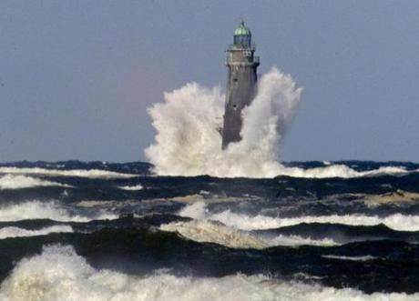 Rough sea pounded Minot Light at the entrance of Scituate and Cohasset harbors.
